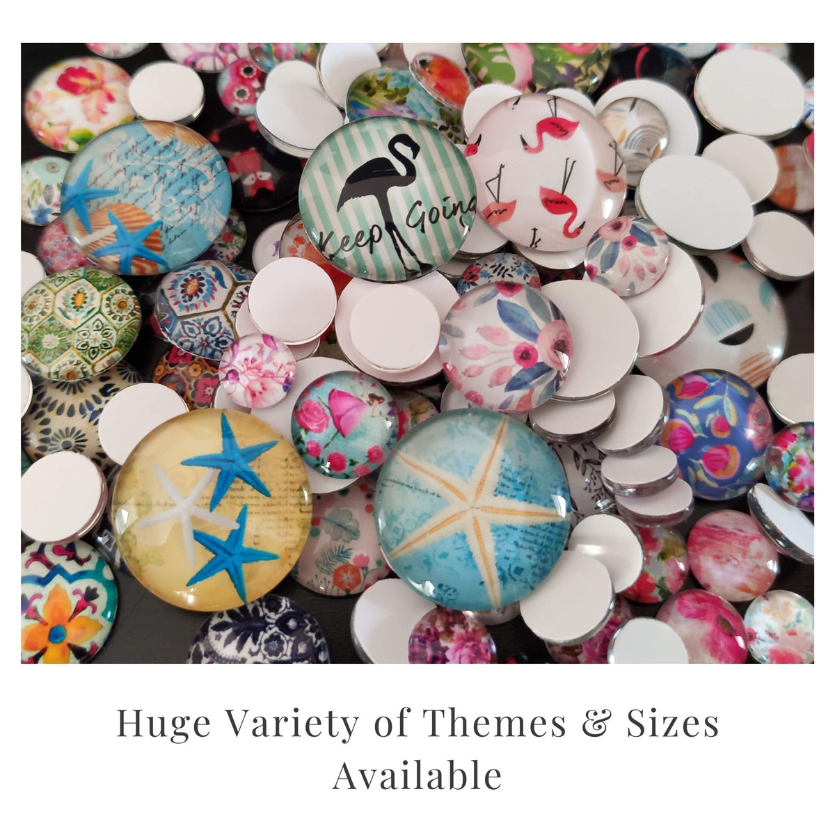 Assorted round glass cabochons with colorful floral, tropical and vintage designs in different sizes