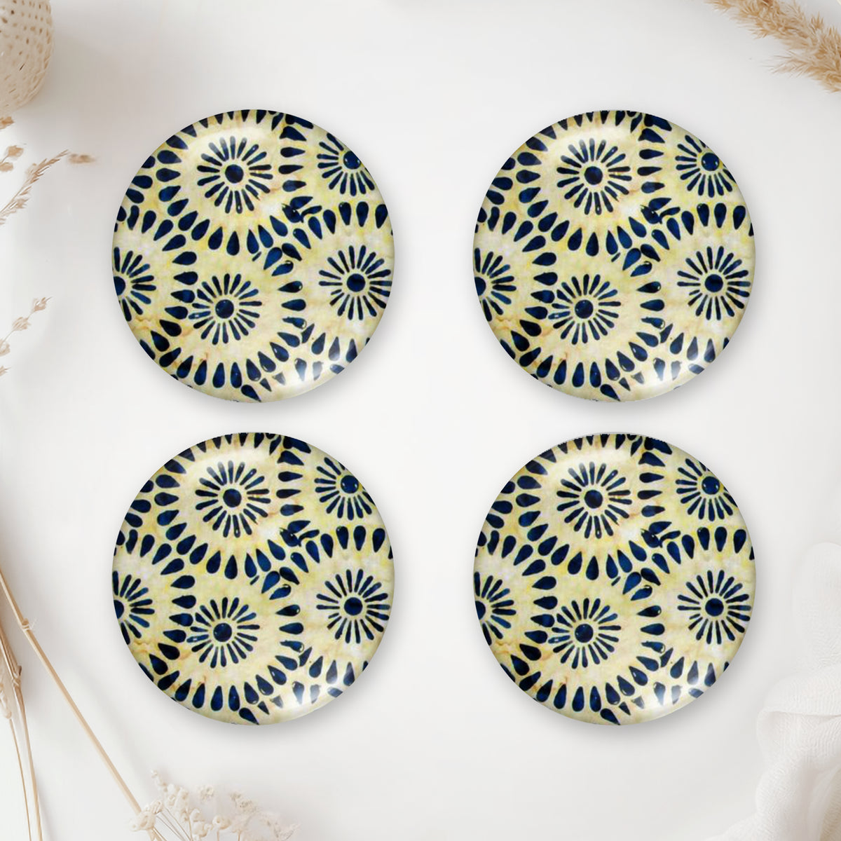 Four handmade round glass cabochons with blue and yellow retro geometric pattern