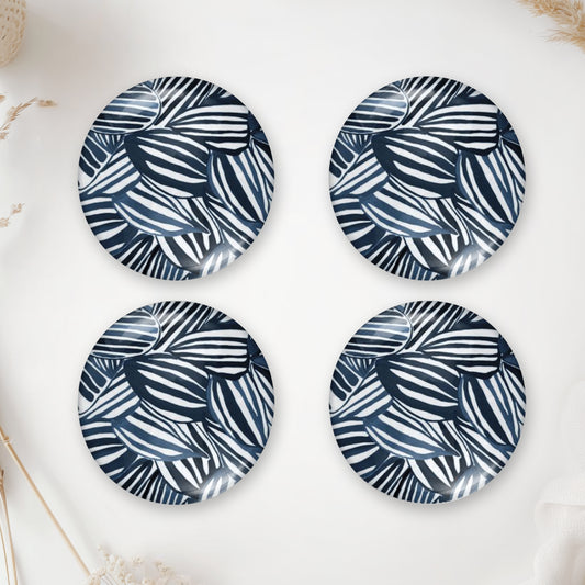 Four round photo cabochons with a navy blue and white leaf pattern