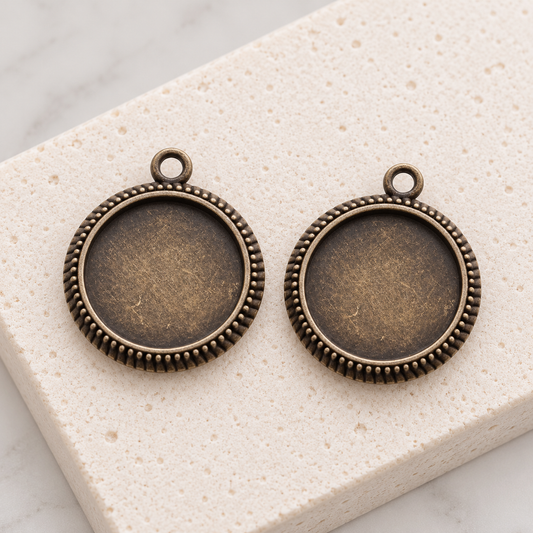 Antique bronze pendant trays with plain round edges for making handmade necklaces.
