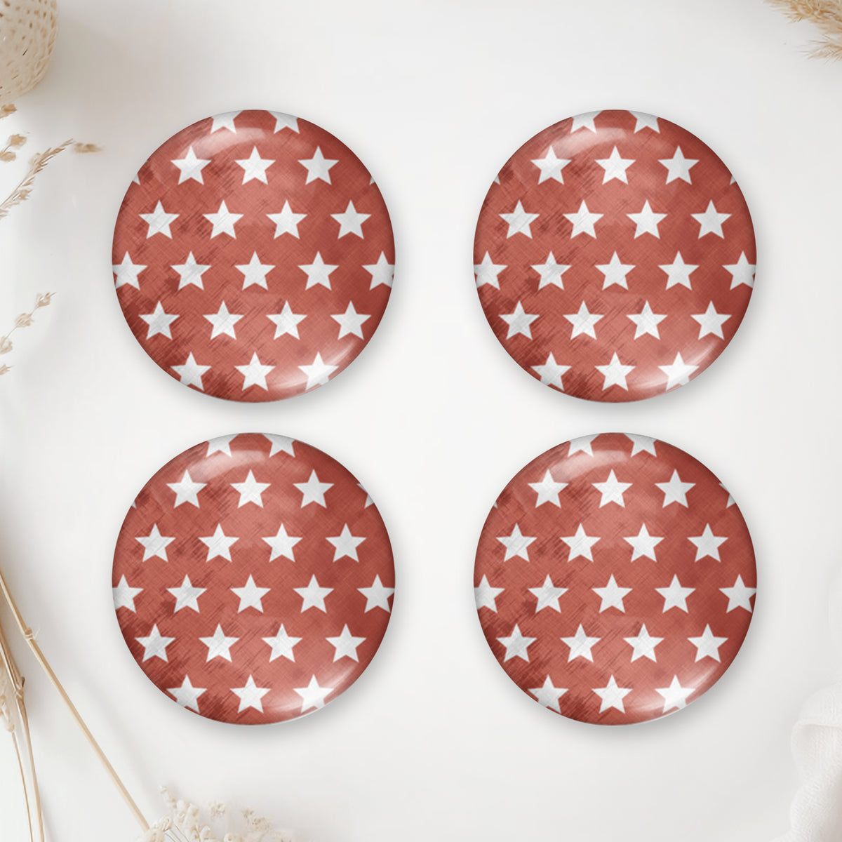 Four round terracotta glass domes with small white stars