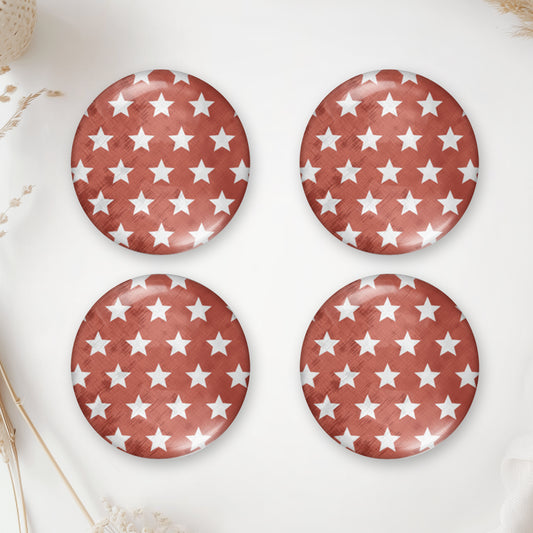 Four round terracotta glass domes with small white stars