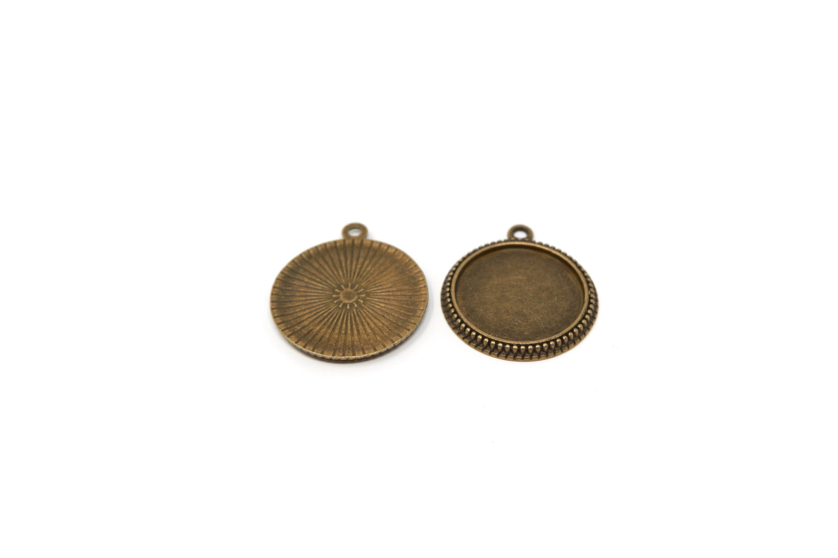 Back view of antique bronze pendant bases with hanging loops