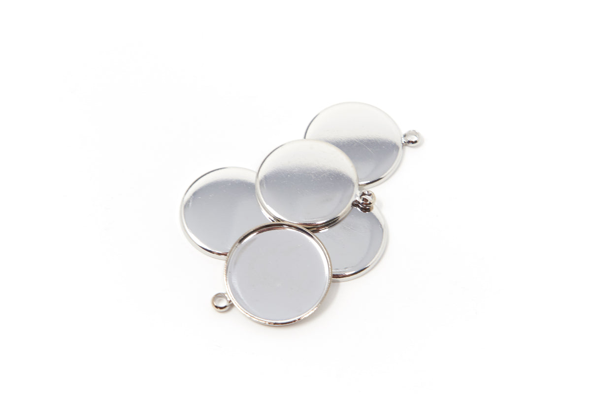 rFive plain-edge round stainless steel bezel cups with hanging loops on a white background.
