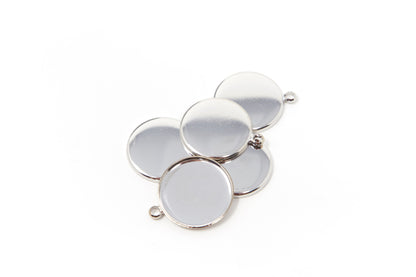 rFive plain-edge round stainless steel bezel cups with hanging loops on a white background.